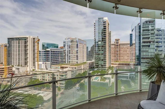 a view of a patio with chairs and a table
