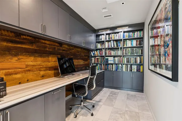 a view of a workspace with furniture