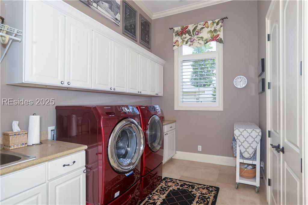 21 Caravelle Lane Bluffton, SC 29909 - Photo 40 of 66 The laundry room has a deep sink with a folding co