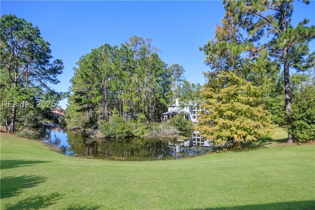21 Caravelle Lane Bluffton, SC 29909 - Photo 65 of 66 This is the view of the lagoon fountain from the l