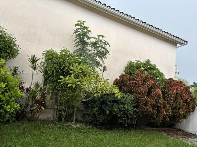 a backyard of a house with lots of green space