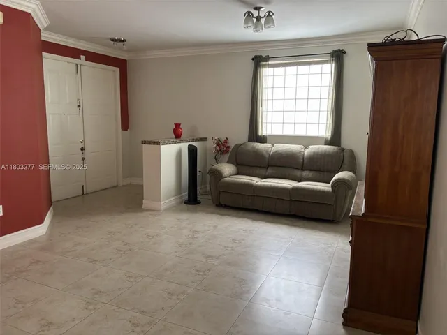 a living room with furniture and a window
