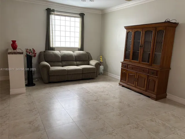 a living room with furniture and a window