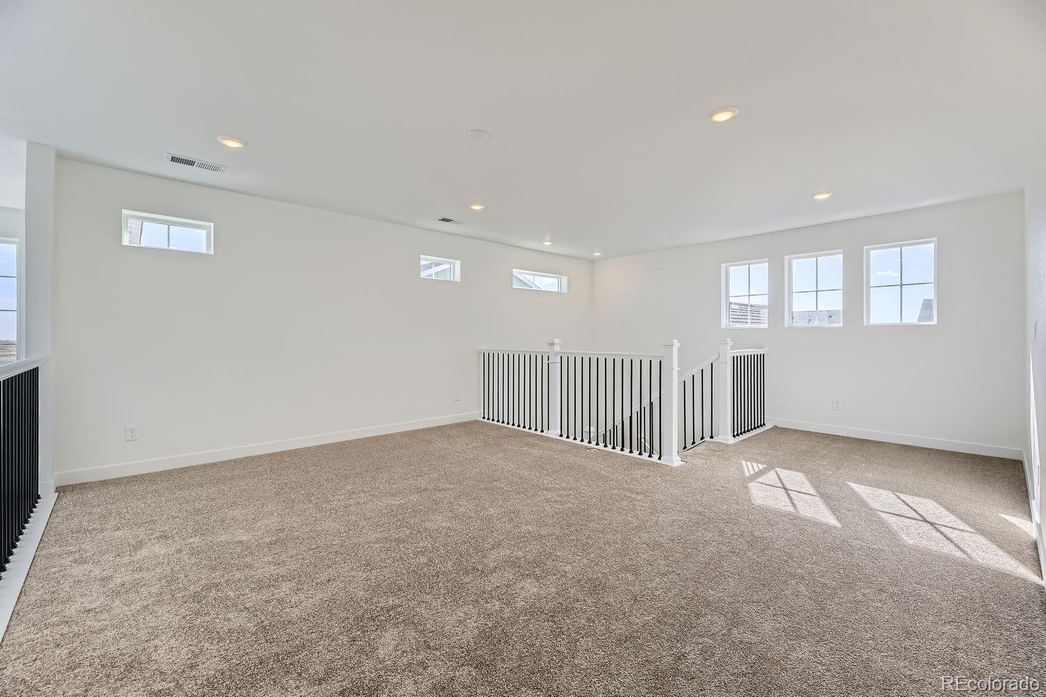 907 Congress Place Elizabeth, CO 80107 - Photo 11 of 19 an empty room with windows