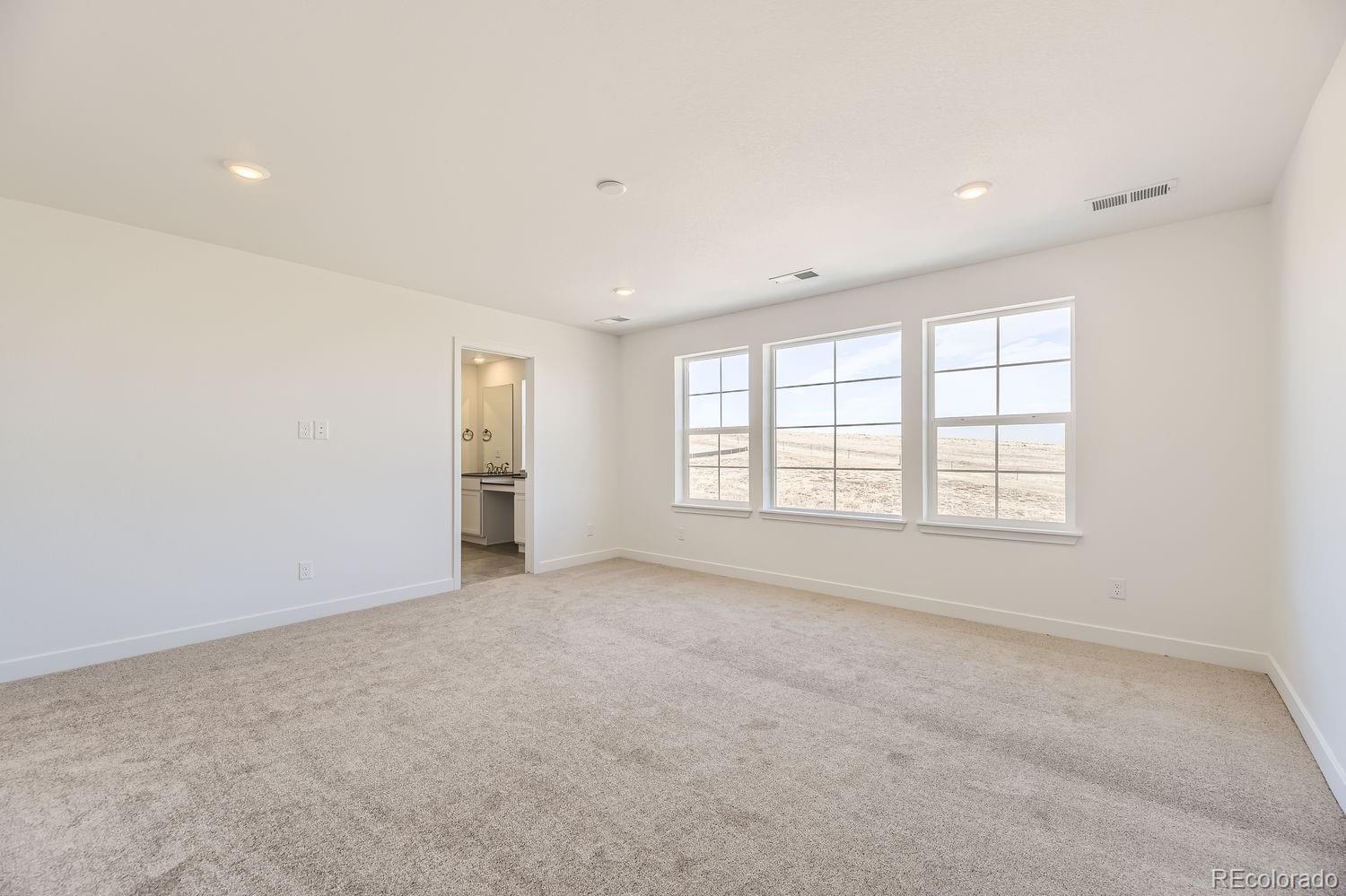 907 Congress Place Elizabeth, CO 80107 - Photo 7 of 19 an empty room with windows