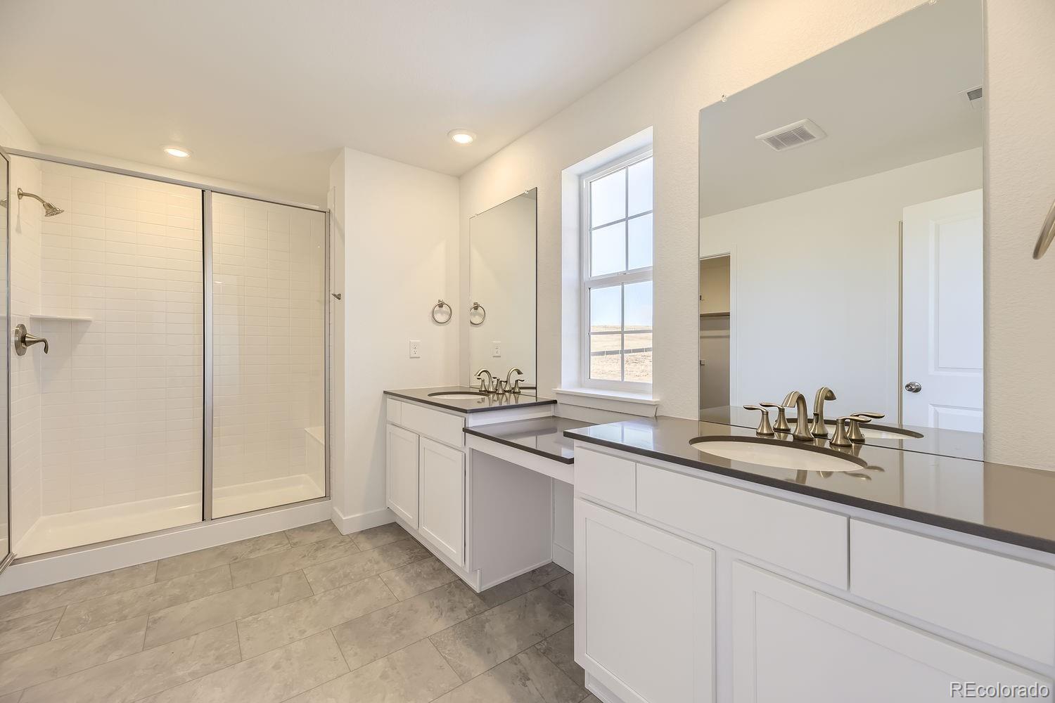 907 Congress Place Elizabeth, CO 80107 - Photo 8 of 19 a kitchen with stainless steel appliances granite countertop a sink and a refrigerator
