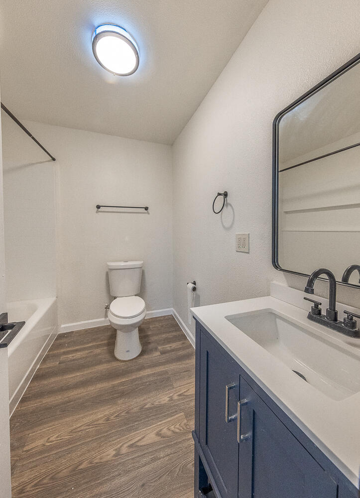 2002 65th Street Lubbock, TX 79412 - Photo 13 of 25 a bathroom with a sink and a mirror