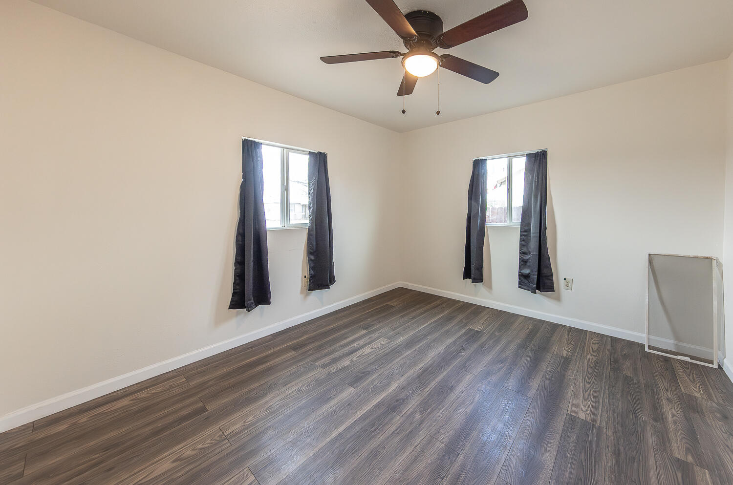 2002 65th Street Lubbock, TX 79412 - Photo 16 of 25 an empty room with wooden floor and windows