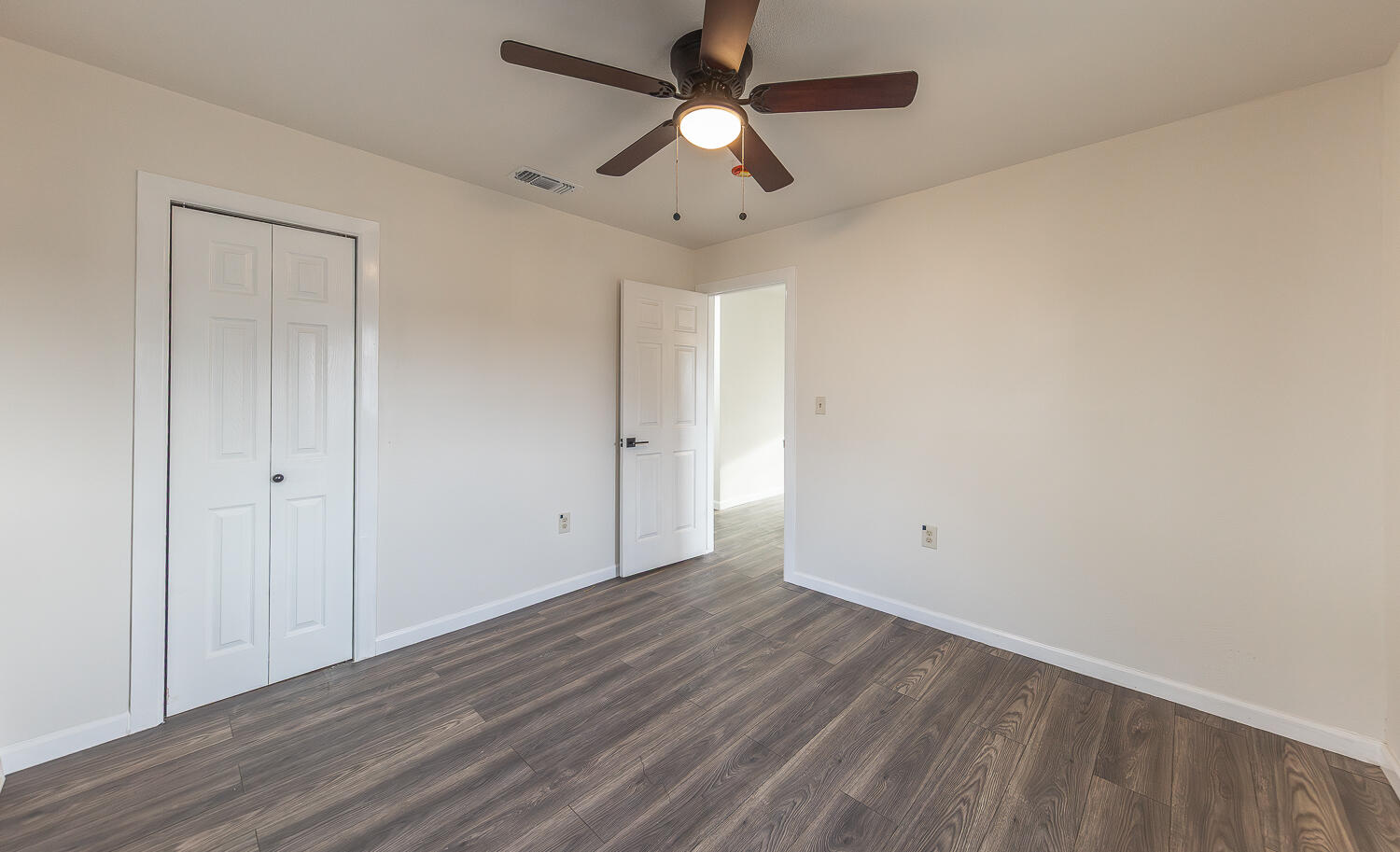 2002 65th Street Lubbock, TX 79412 - Photo 17 of 25 wooden floor in an empty room