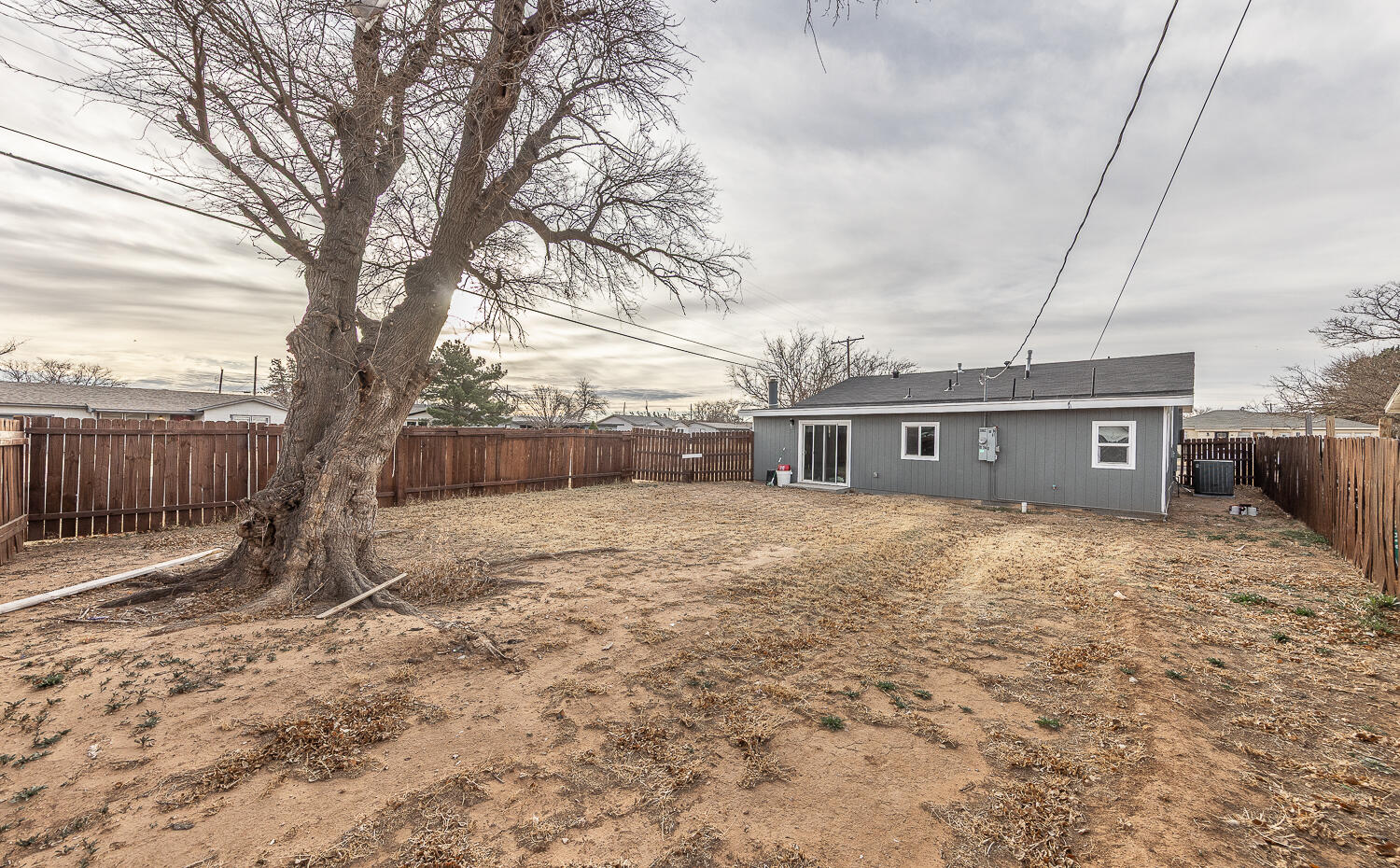 2002 65th Street Lubbock, TX 79412 - Photo 23 of 25 a house view with a backyard space
