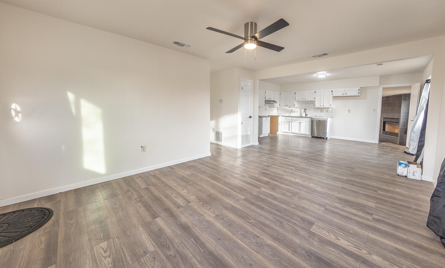 2002 65th Street Lubbock, TX 79412 - Photo 4 of 25 a view of a kitchen with wooden floor and a window