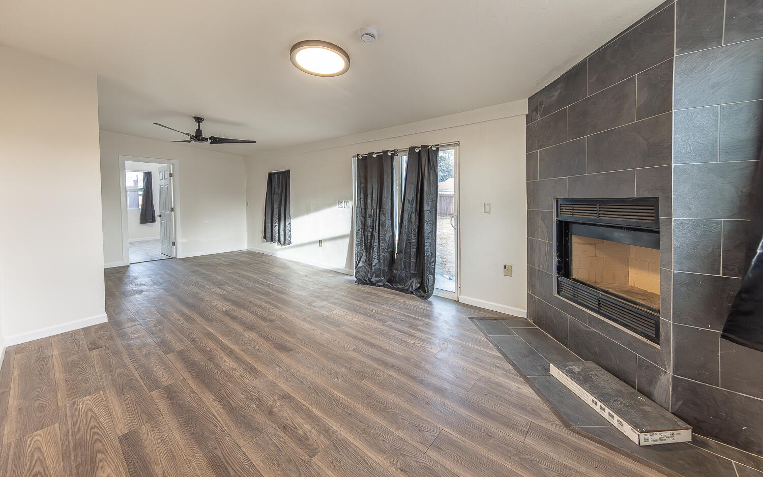 2002 65th Street Lubbock, TX 79412 - Photo 8 of 25 a view of an empty room and fire place