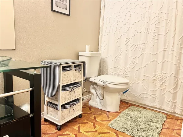 a bathroom with a toilet and a sink