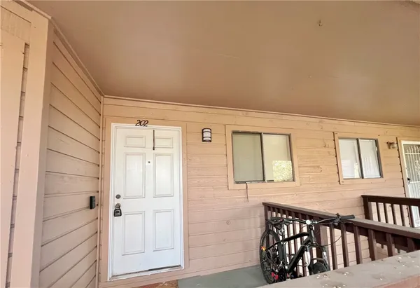 a view of an outdoor sitting area with furniture