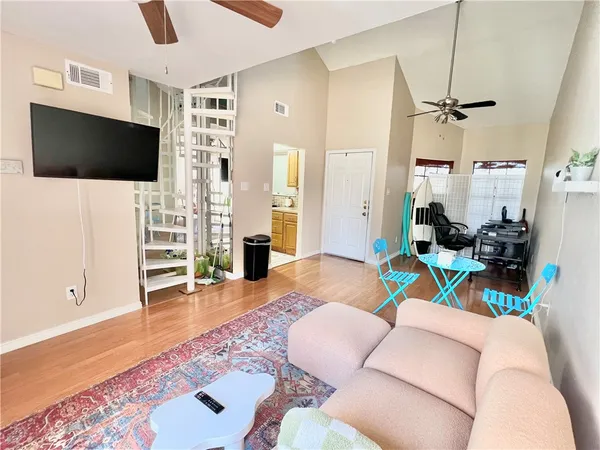 a living room with furniture and a flat screen tv