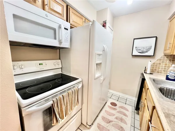 a kitchen with a stove and a microwave