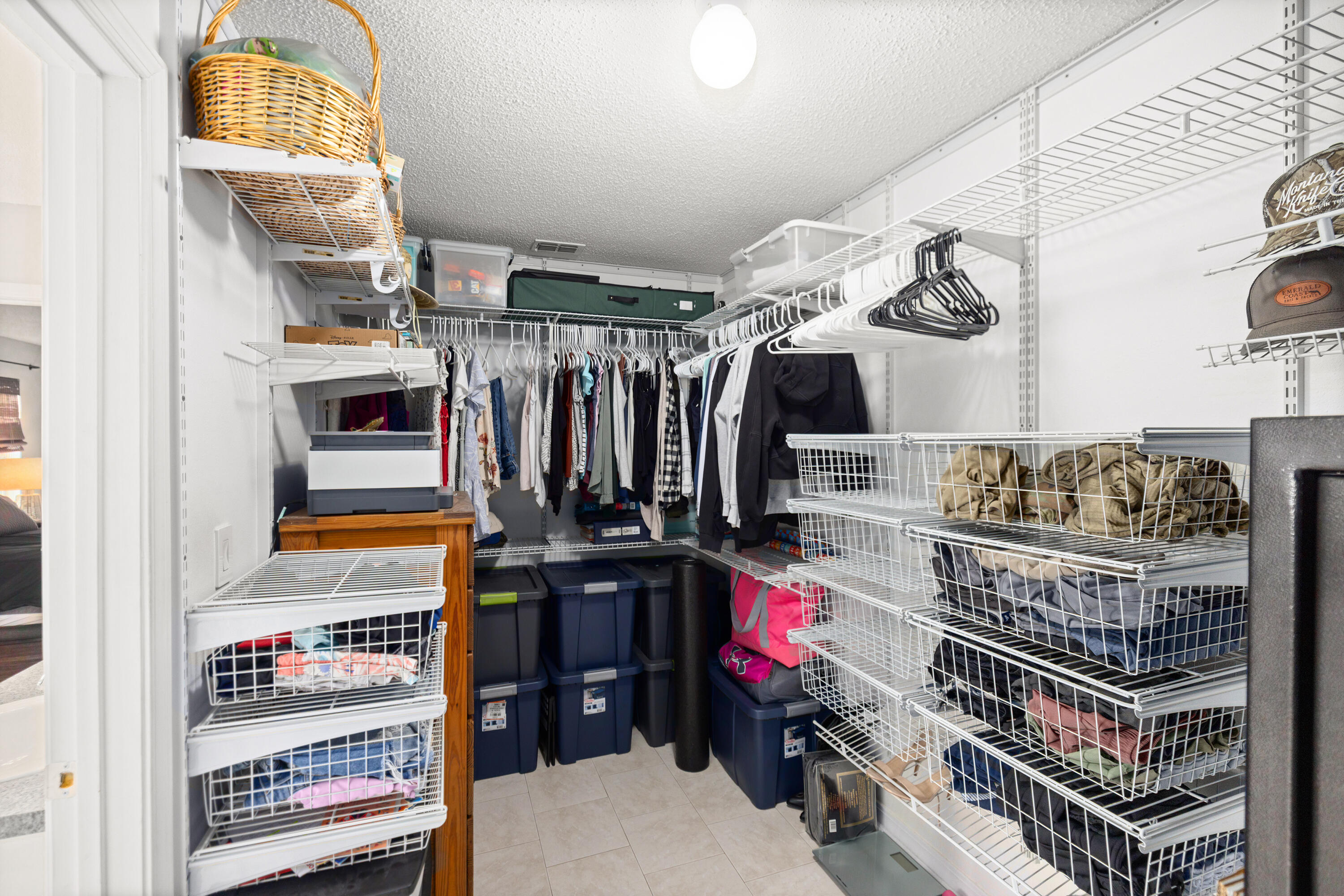 202 Limestone Circle Crestview, FL 32539 - Photo 26 of 49 a view of walk in closet with clothes and shoes