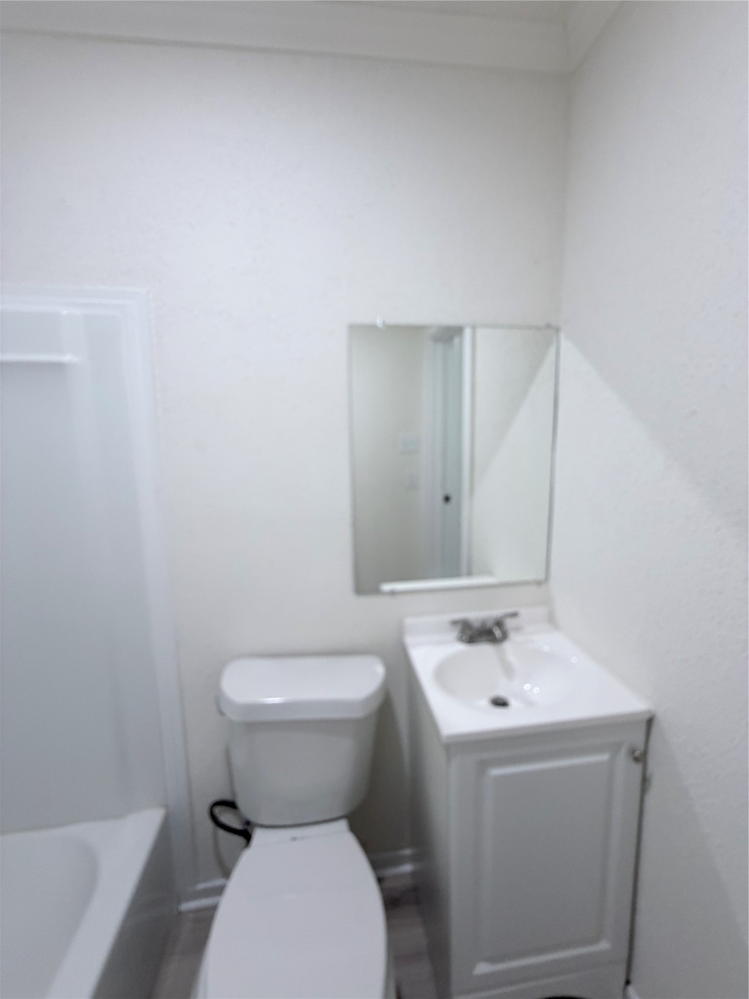 1112 3rd Street La Marque, TX 77568 - Photo 15 of 21 a white toilet sitting next to a bathroom sink