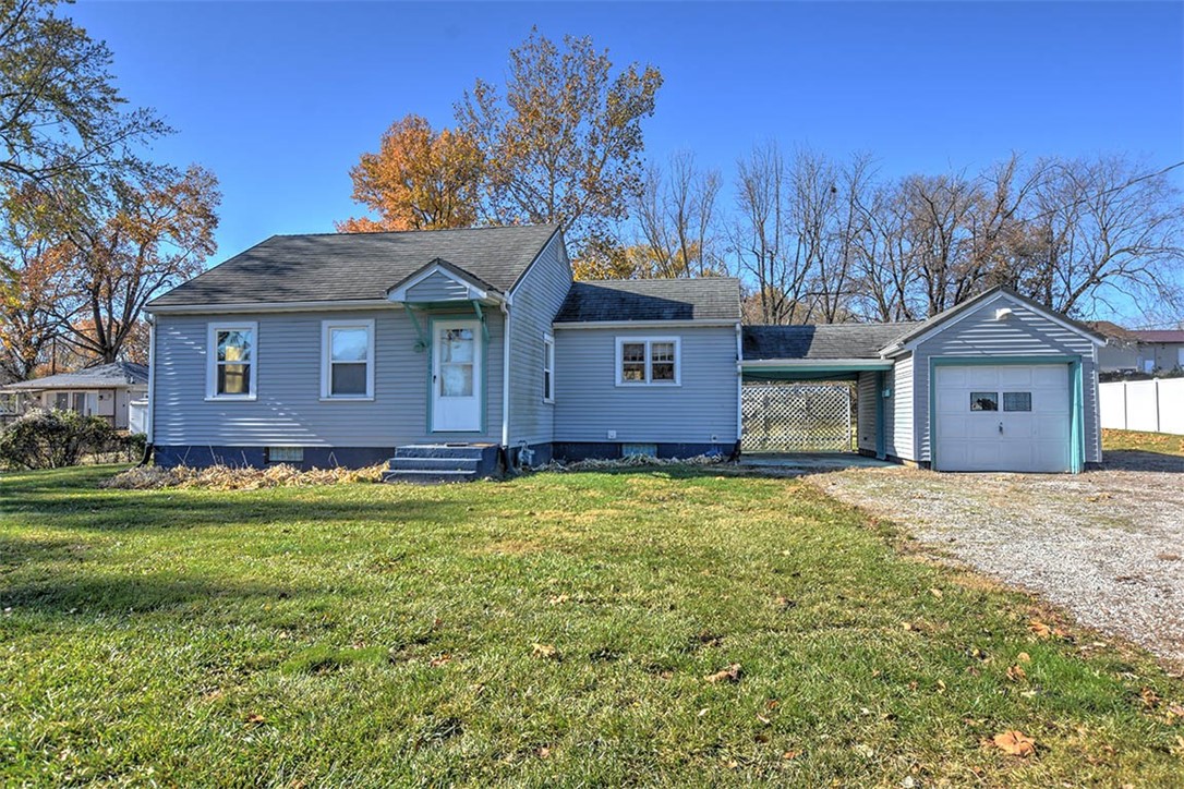 1765 South Fairview Avenue Decatur, IL 62521 - Photo 6 of 24 a front view of a house with a garden and yard