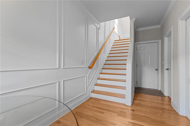 2744 Blakely Drive Northeast Suwanee, GA 30024 - Photo 19 of 45 a view of an entryway with wooden floor