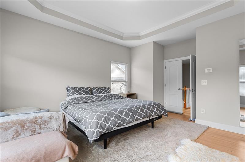 2744 Blakely Drive Northeast Suwanee, GA 30024 - Photo 28 of 45 a bedroom with a bed and window