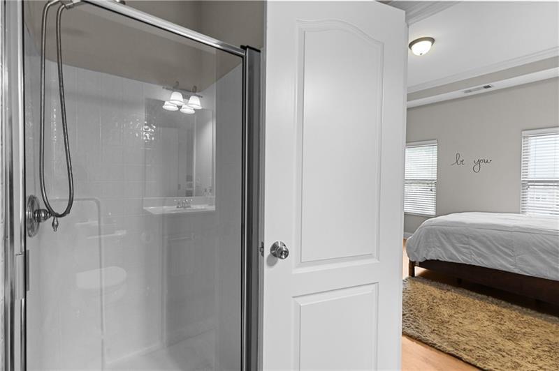 2744 Blakely Drive Northeast Suwanee, GA 30024 - Photo 35 of 45 a en suite bathroom with a shower and a mirror