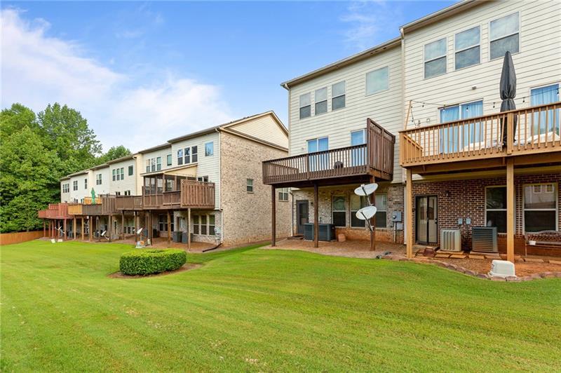 2744 Blakely Drive Northeast Suwanee, GA 30024 - Photo 40 of 45 a view of a building with a yard