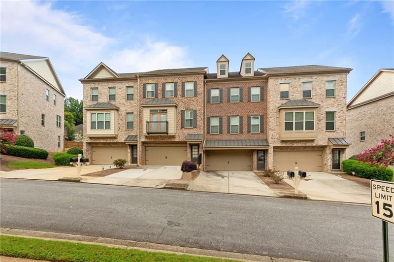 2744 Blakely Drive Northeast Suwanee, GA 30024 - Photo 45 of 45 a front view of a building with street
