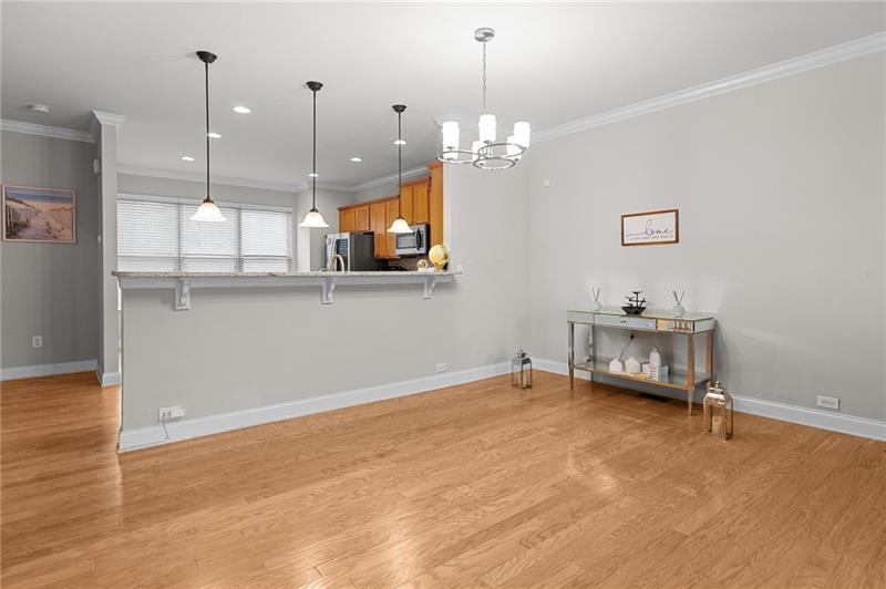 2744 Blakely Drive Northeast Suwanee, GA 30024 - Photo 8 of 45 a view of a room with gym equipment and wooden floor