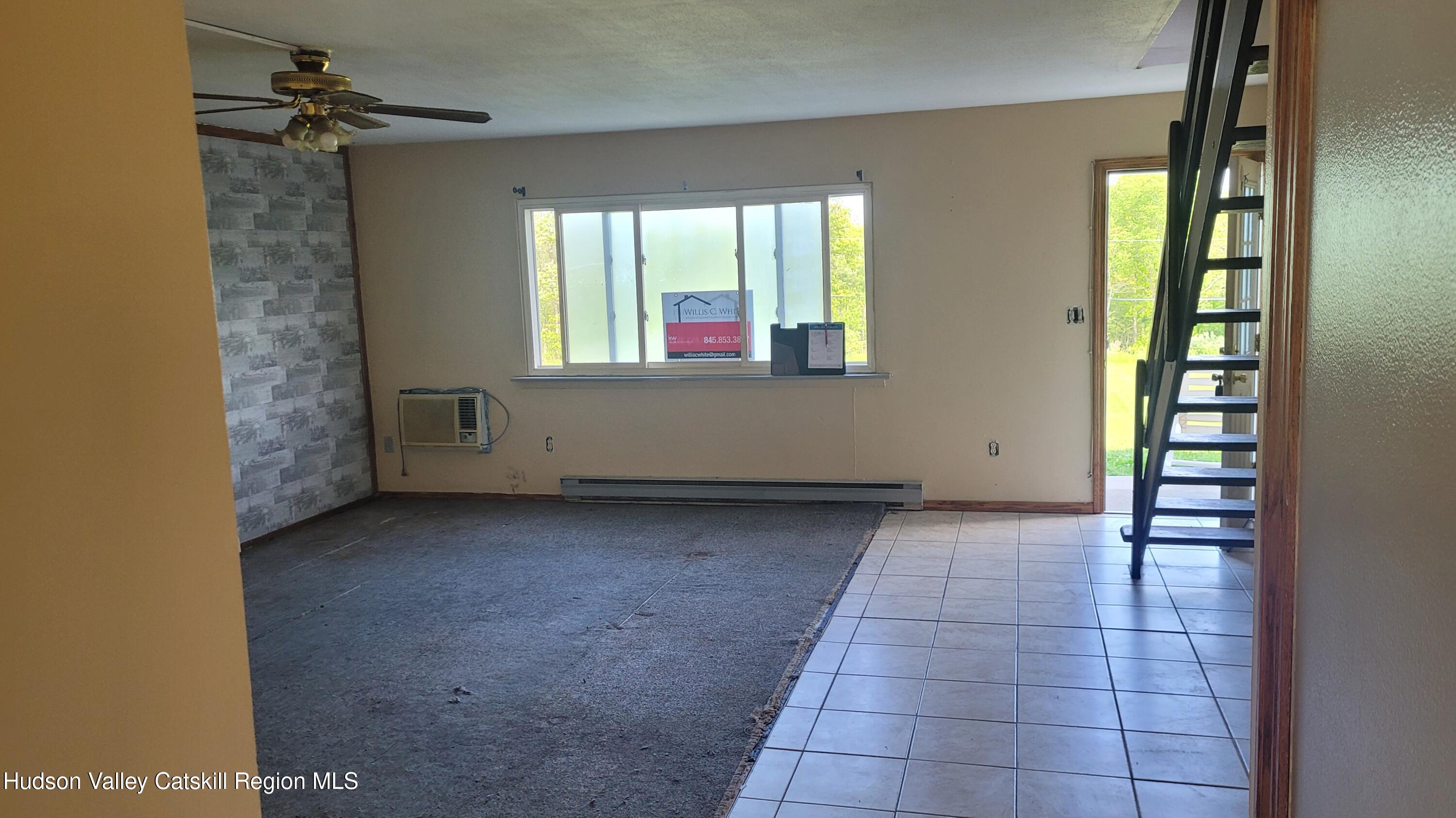 881 Albany Post Road, Unit 5 New Paltz, NY 12561 - Photo 3 of 16 a view of an empty room with a window