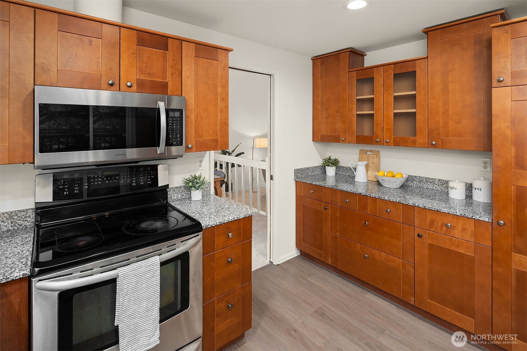 15710 Southeast 46th Way Bellevue, WA 98006 - Photo 12 of 40 a kitchen with stainless steel appliances a stove sink and microwave