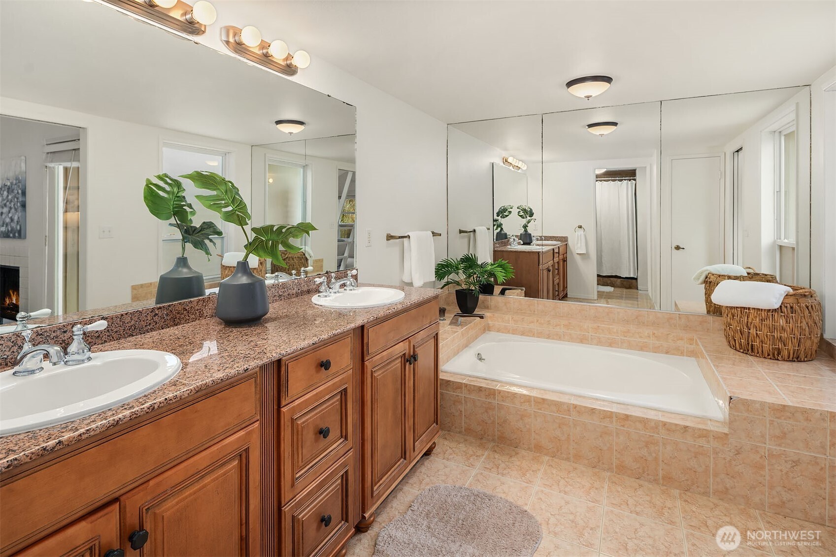 15710 Southeast 46th Way Bellevue, WA 98006 - Photo 20 of 40 a spacious bathroom with a granite countertop sink and a mirror