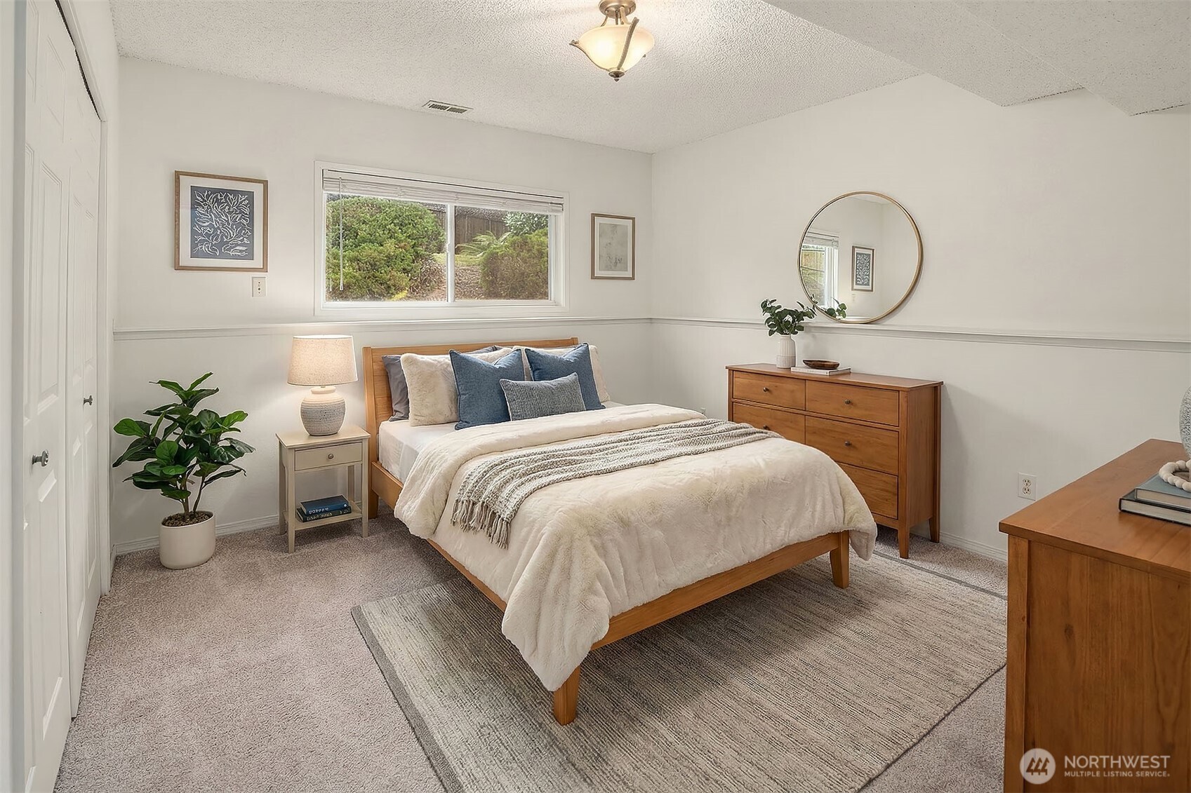 15710 Southeast 46th Way Bellevue, WA 98006 - Photo 24 of 40 a bedroom with bed and a window