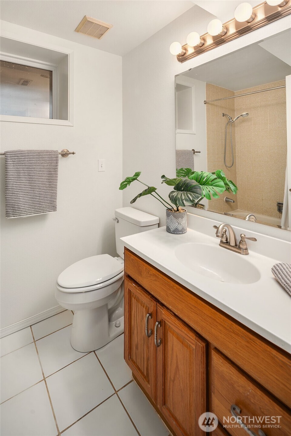 15710 Southeast 46th Way Bellevue, WA 98006 - Photo 28 of 40 a bathroom with a sink a toilet and mirror