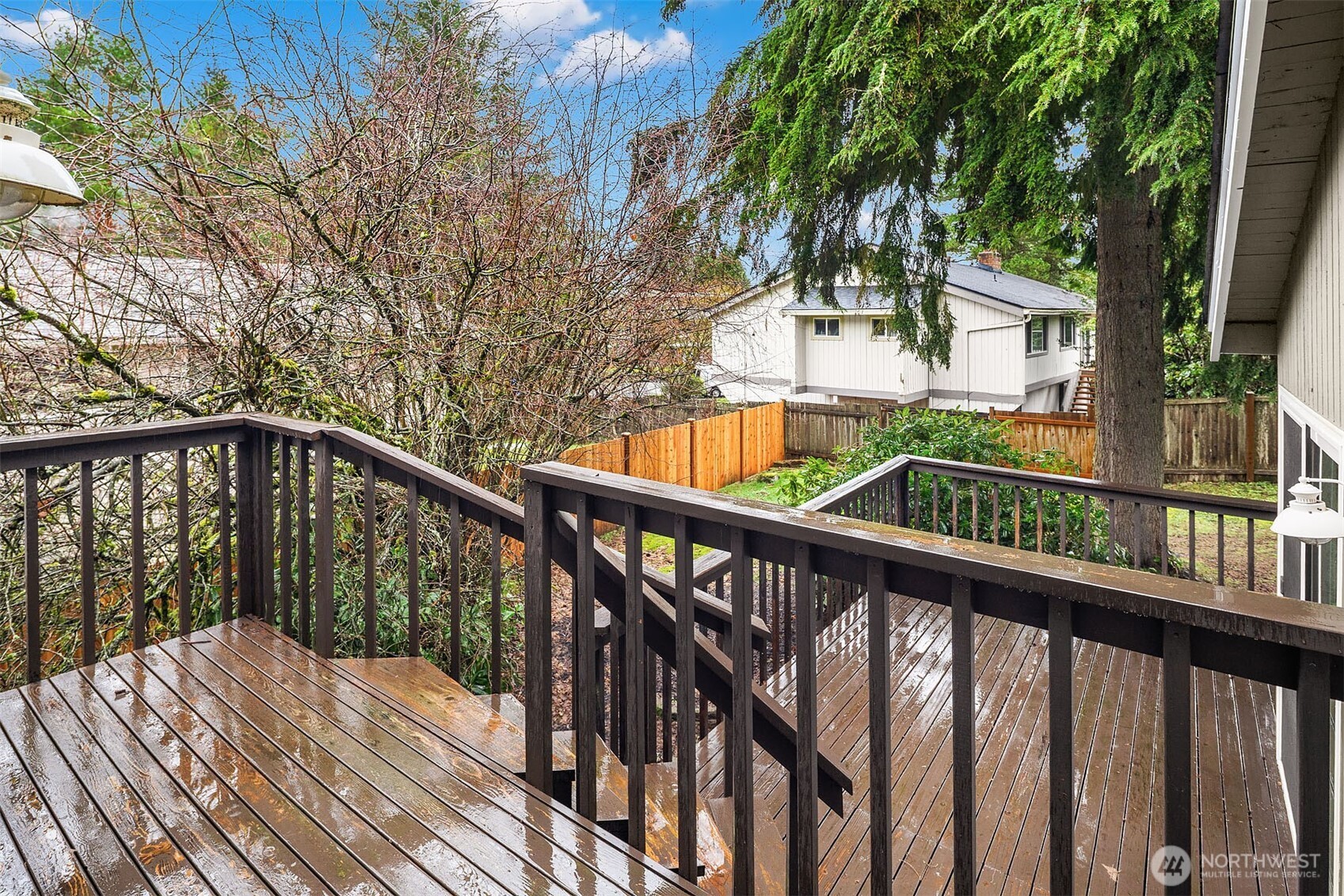15710 Southeast 46th Way Bellevue, WA 98006 - Photo 31 of 40 a view of balcony with wooden floor and fence