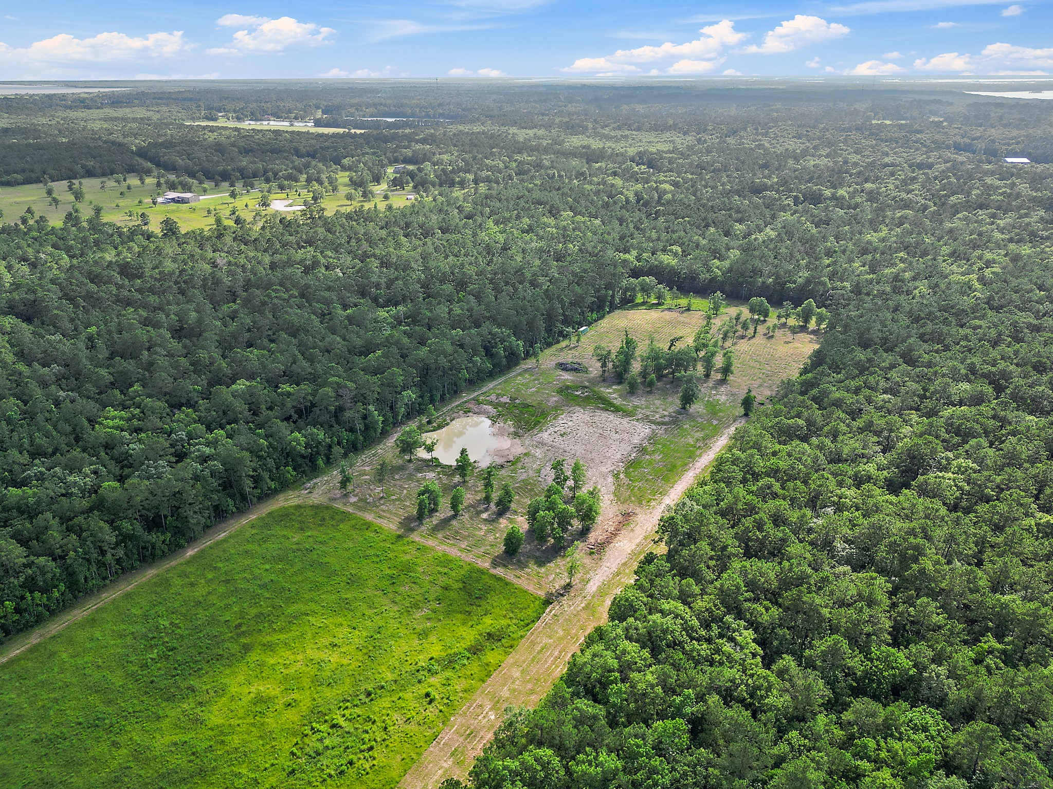 Tbd Labrador Lane Wallisville, TX 77597 - Photo 9 of 11 a view of a lake with a yard