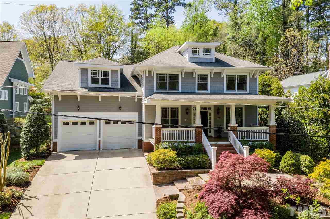 1407 Nottingham Road Raleigh, NC 27607 - Photo 1 of 30 a front view of a house with a yard and potted plants
