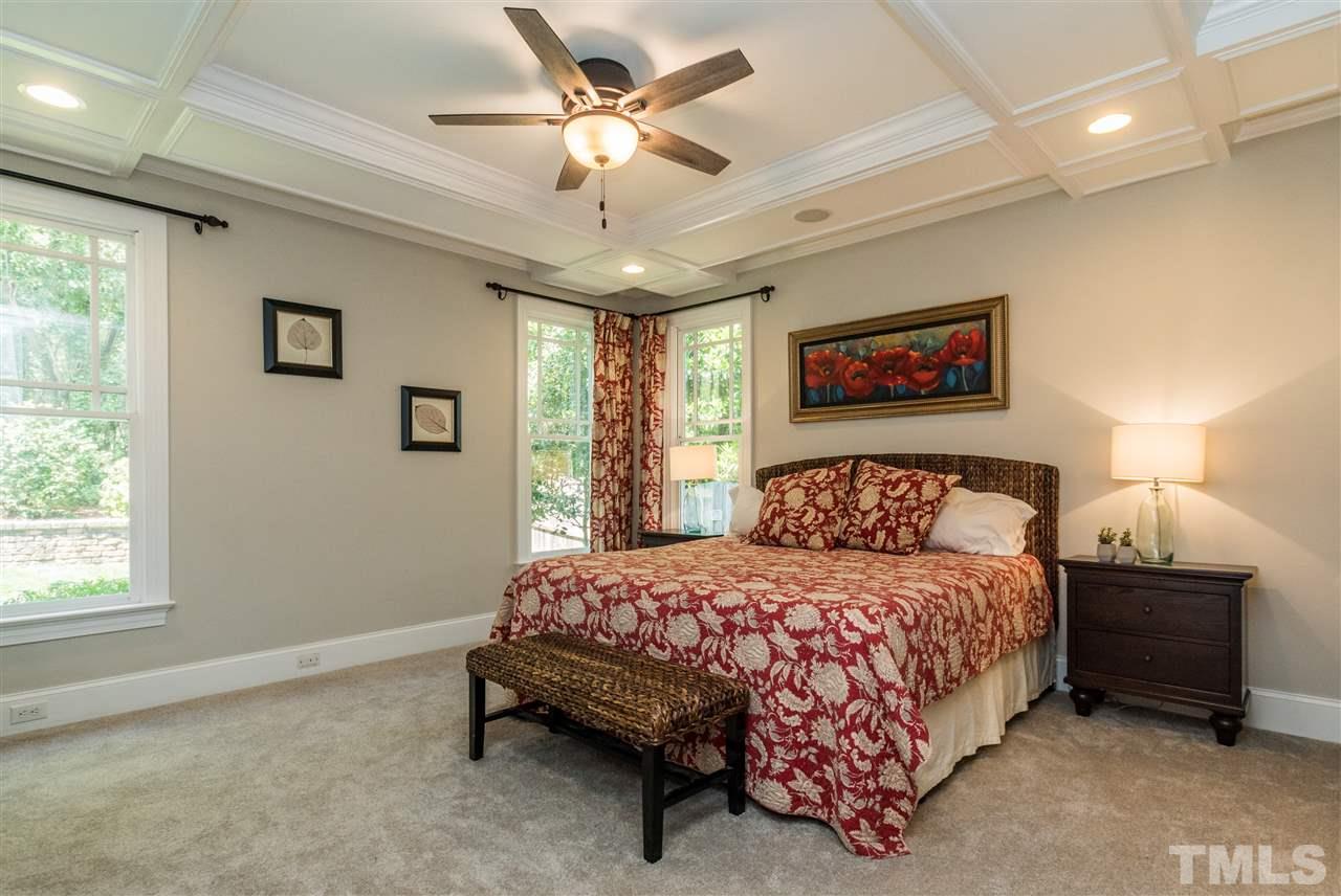 1407 Nottingham Road Raleigh, NC 27607 - Photo 14 of 30 a bedroom with a bed a ceiling fan and a dresser