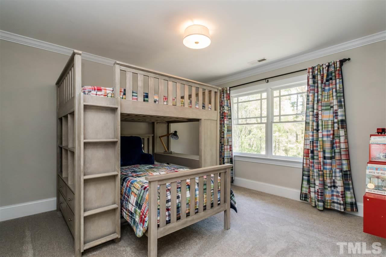 1407 Nottingham Road Raleigh, NC 27607 - Photo 21 of 30 a bedroom with furniture and a window