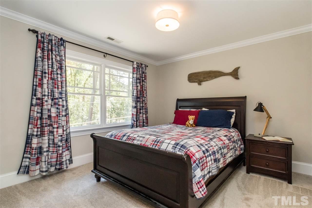 1407 Nottingham Road Raleigh, NC 27607 - Photo 22 of 30 a bedroom with a bed and a window