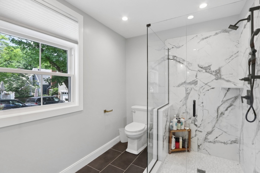 49 A Chestnut Street, Unit 1 Wakefield, MA 01880 - Photo 13 of 22 a bathroom with a toilet sink and a shower