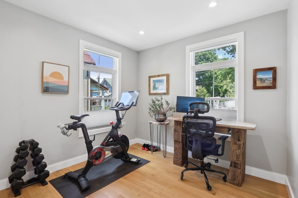 49 A Chestnut Street, Unit 1 Wakefield, MA 01880 - Photo 14 of 22 a view of a workspace with furniture and a window
