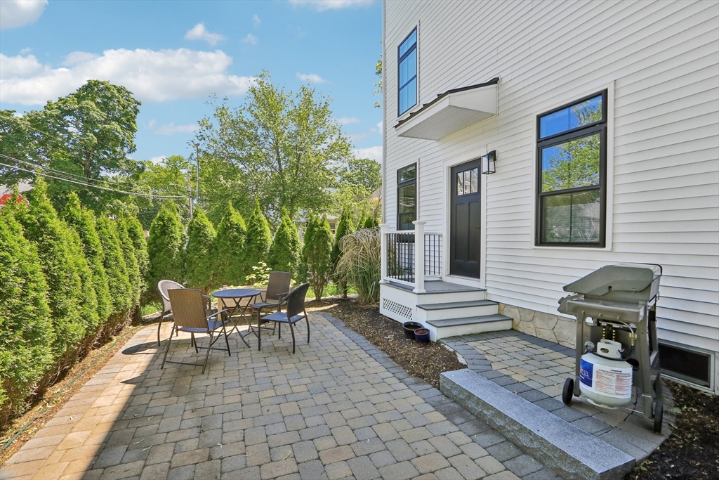 49 A Chestnut Street, Unit 1 Wakefield, MA 01880 - Photo 19 of 22 a view of a patio with couple of chairs and a couch
