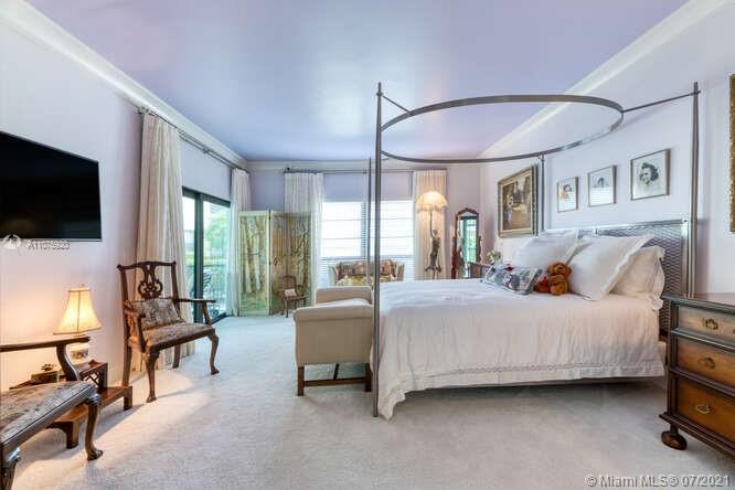 275 South Beach Road, Unit A103 Tequesta, FL 33469 - Photo 21 of 35 a bed room with a bed television and a large window