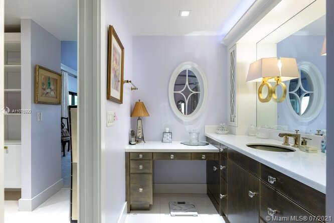 275 South Beach Road, Unit A103 Tequesta, FL 33469 - Photo 23 of 35 a bathroom with a sink and a mirror