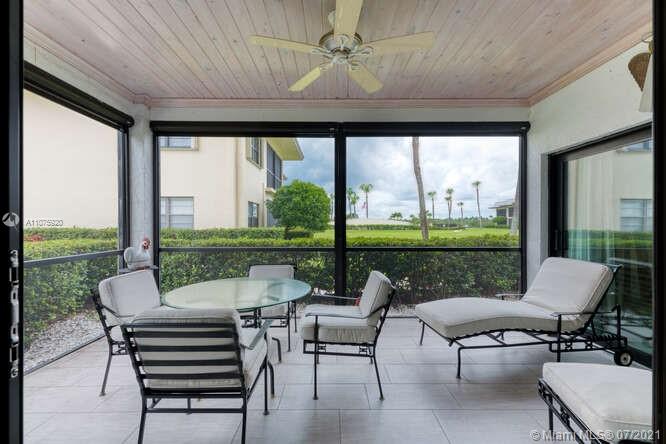 275 South Beach Road, Unit A103 Tequesta, FL 33469 - Photo 28 of 35 a balcony with furniture and a floor to ceiling window
