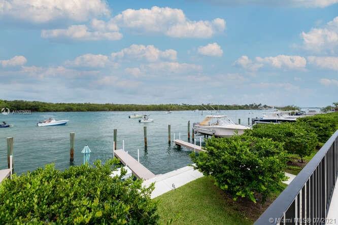 275 South Beach Road, Unit A103 Tequesta, FL 33469 - Photo 29 of 35 a view of a lake with houses in the back
