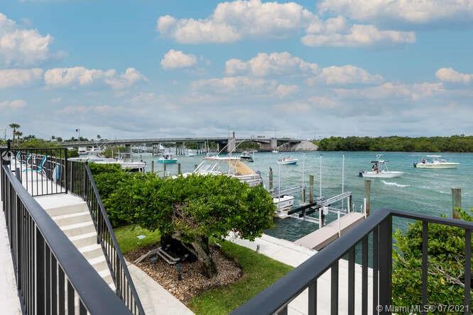 275 South Beach Road, Unit A103 Tequesta, FL 33469 - Photo 30 of 35 a view of a lake from a balcony