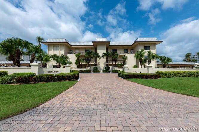 275 South Beach Road, Unit A103 Tequesta, FL 33469 - Photo 4 of 35 a front view of building with yard