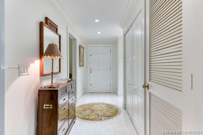 275 South Beach Road, Unit A103 Tequesta, FL 33469 - Photo 6 of 35 a view of a hallway to a livingroom with furniture